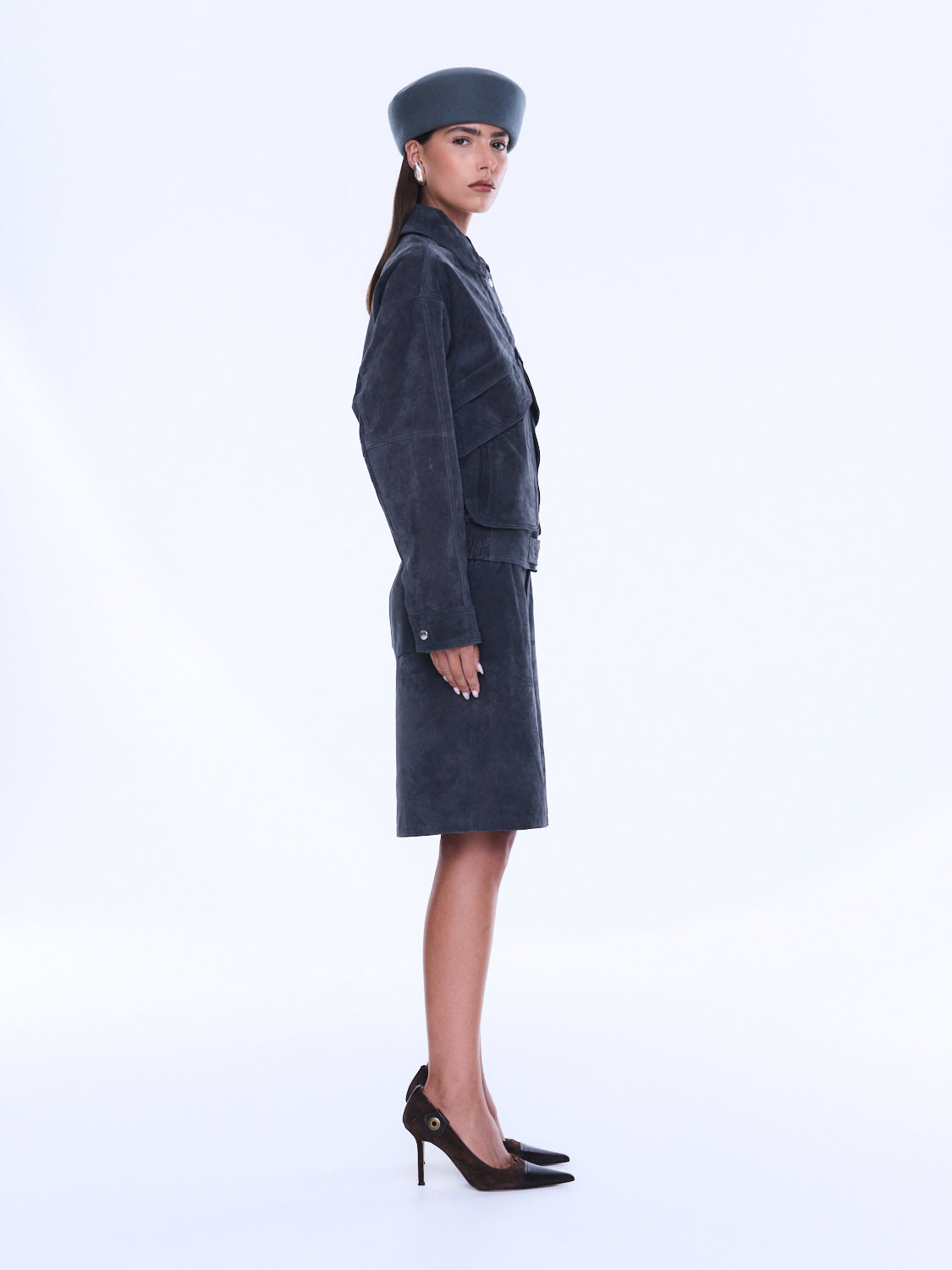 Side profile view of Emma Utility Suede Jacket displaying knee-length silhouette and utility pocket details