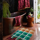 Sage & Clare Eliza hand towel in primrose yellow hanging in modern bathroom lifestyle setting
