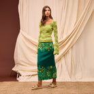 Model styled in white tee with Sage Clare Eliza Knit Maxi Skirt for casual chic look