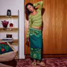 Side profile of Eliza Knit Maxi Skirt highlighting floral knit pattern and midi-maxi length