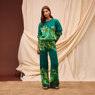 Front view of model wearing Sage & Clare Eliza Knit Pants with matching sweater against cream backdrop