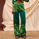Close-up front view of Eliza Knit Pants showing striped waistband and floral knit pattern detail