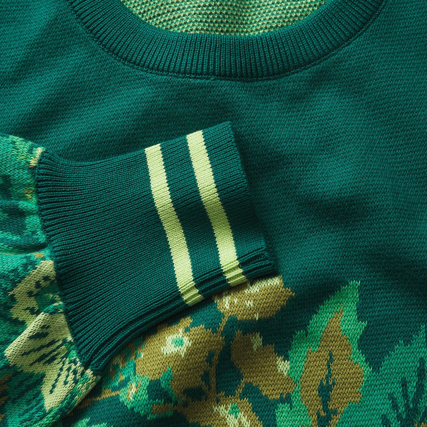 Close-up macro shot of Eliza Knit Sweater fabric texture showing striped cuff detail