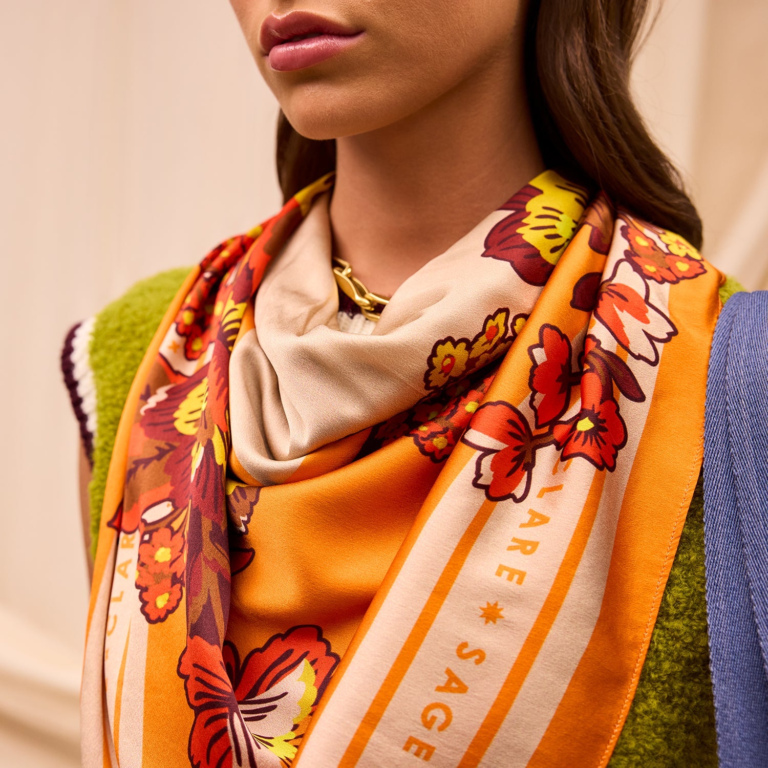 Model wearing Eliza Silk Scarf around neck showing luxurious silk fabric and versatile styling