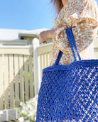 Ellis & Co shopper tote in blue colour carried by a lady