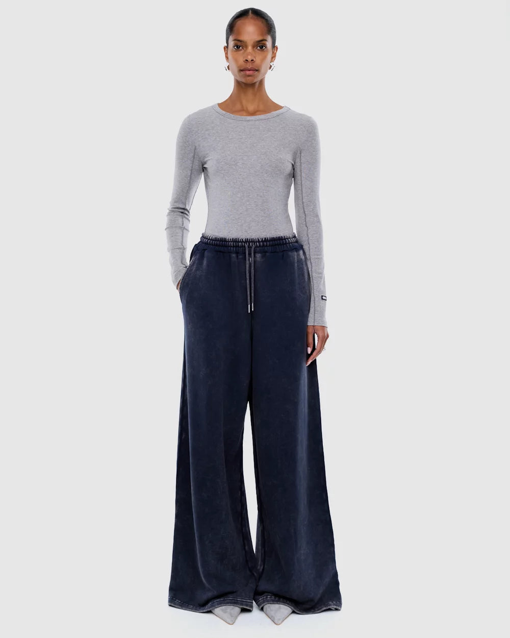 Front view of Asher Track Pant in washed ink with drawstring waist and wide leg styling