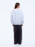 Cotton rich fleece fabric texture detail of Ena Pelly white marle sweatshirt with recycled materials
