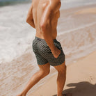 man wearing Evergreen diamond swim shorts by Swim Shady