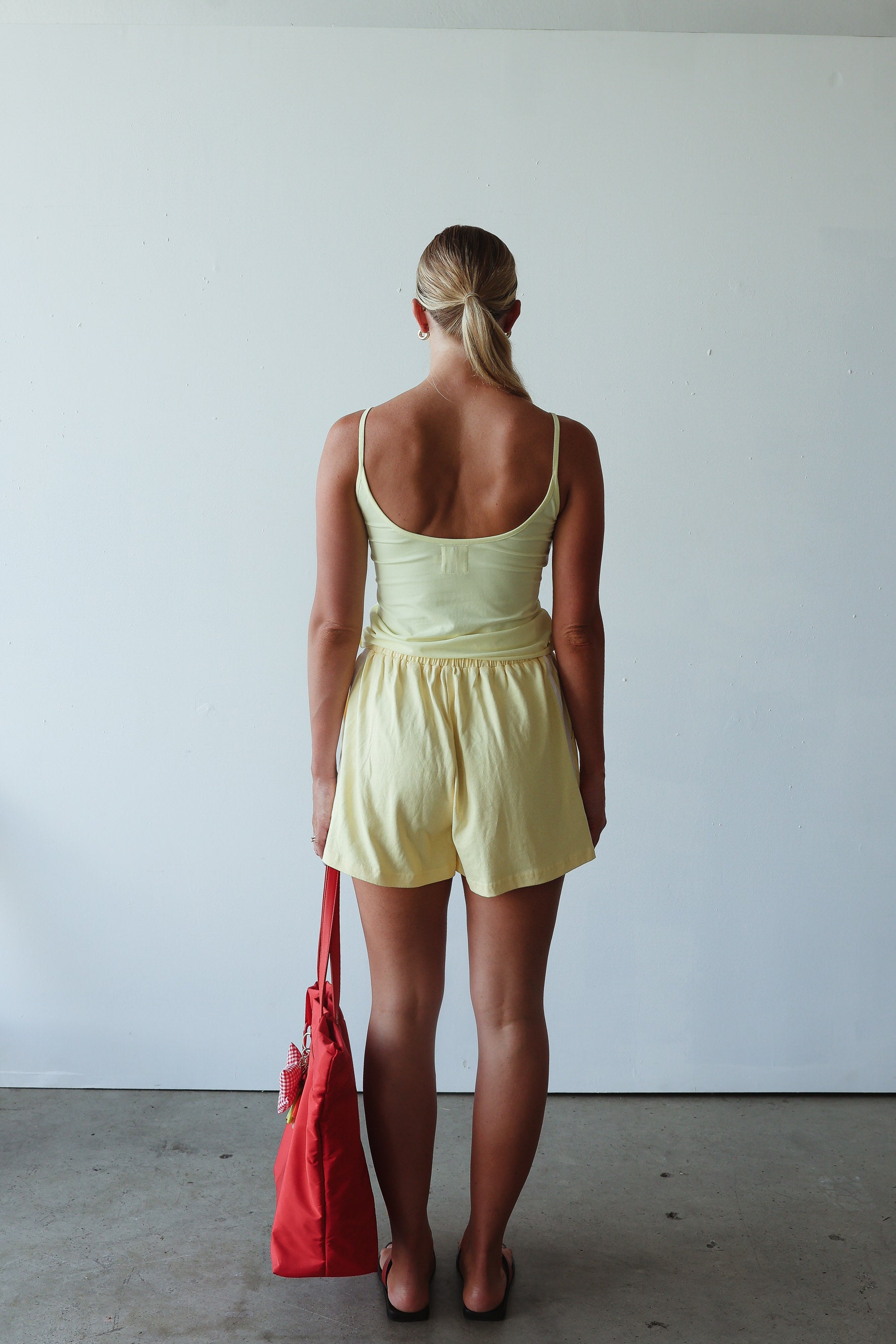 back view of model wearing Everyday Shorts - Butter by By Billie