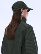 Side profile view of Fallon Check Cap showing curved brim and olive green check fabric detail