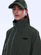Close-up front view of Fallon Zip Thru Jacket showing olive check fabric texture and zipper detail