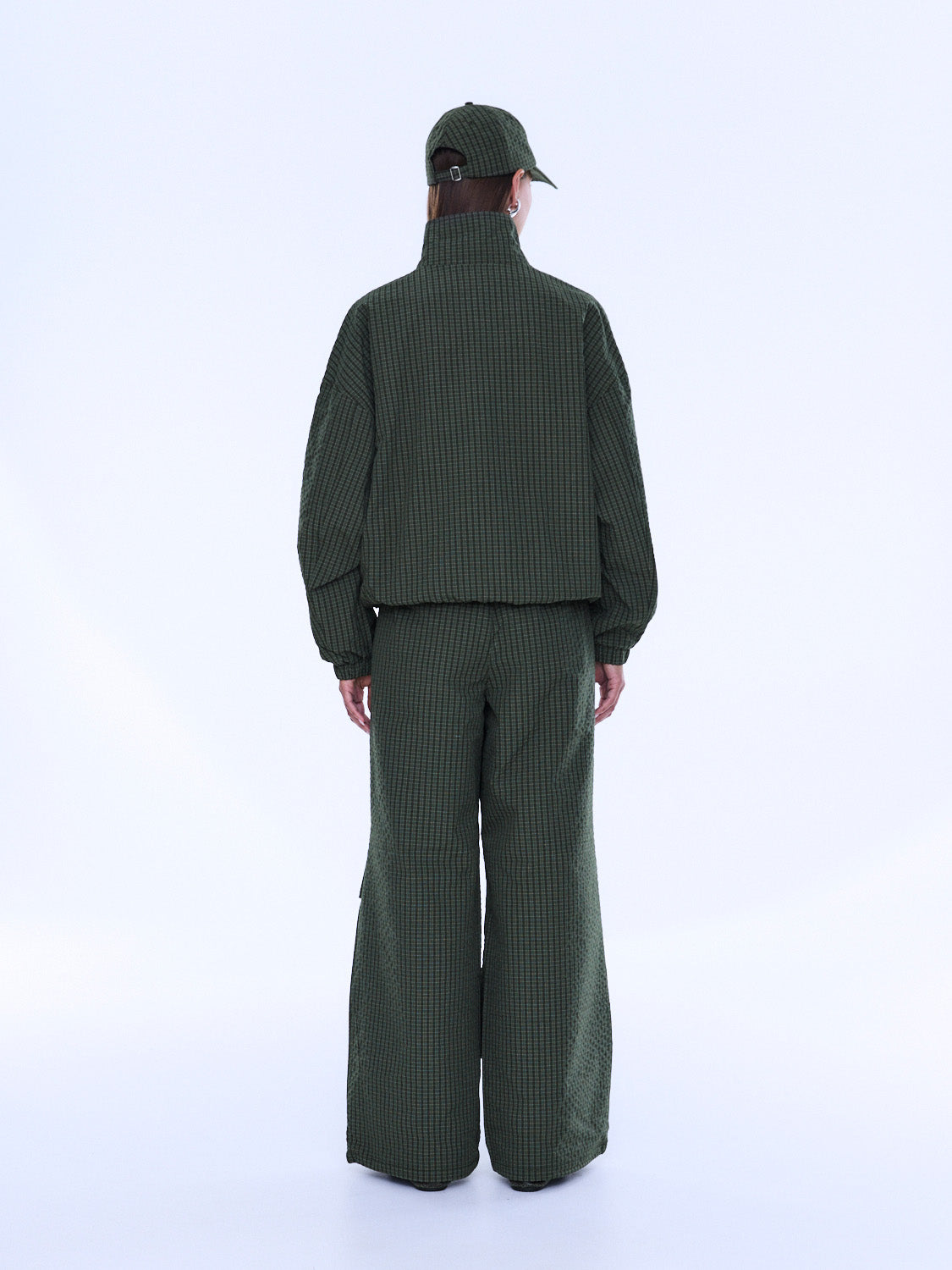 Back view of Fallon Zip Thru Jacket showing olive check pattern and cropped bomber style