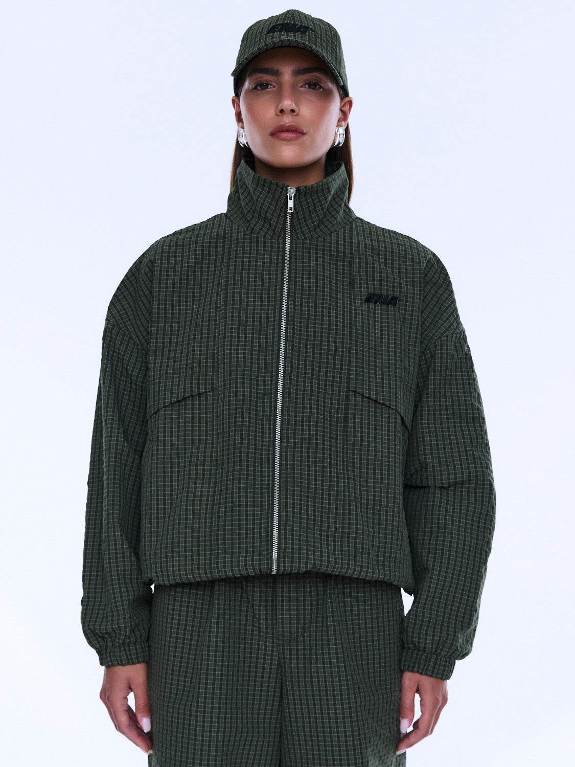 Front view of Fallon Zip Thru Jacket with chest pockets and olive check fabric detail