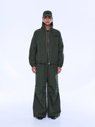 Front view of Fallon Zip Thru Jacket partially unzipped showing olive check pattern and fit
