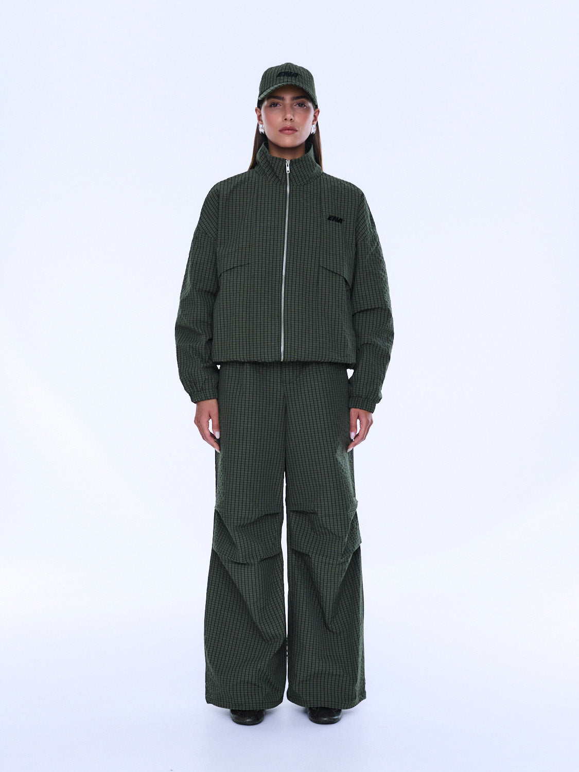 Front styling view of Fallon Zip Thru Jacket in olive check with high collar fully zipped