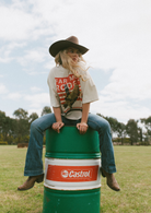 Back view of Rodeo Box Tee showing orange and white rodeo graphic with bull rider illustration