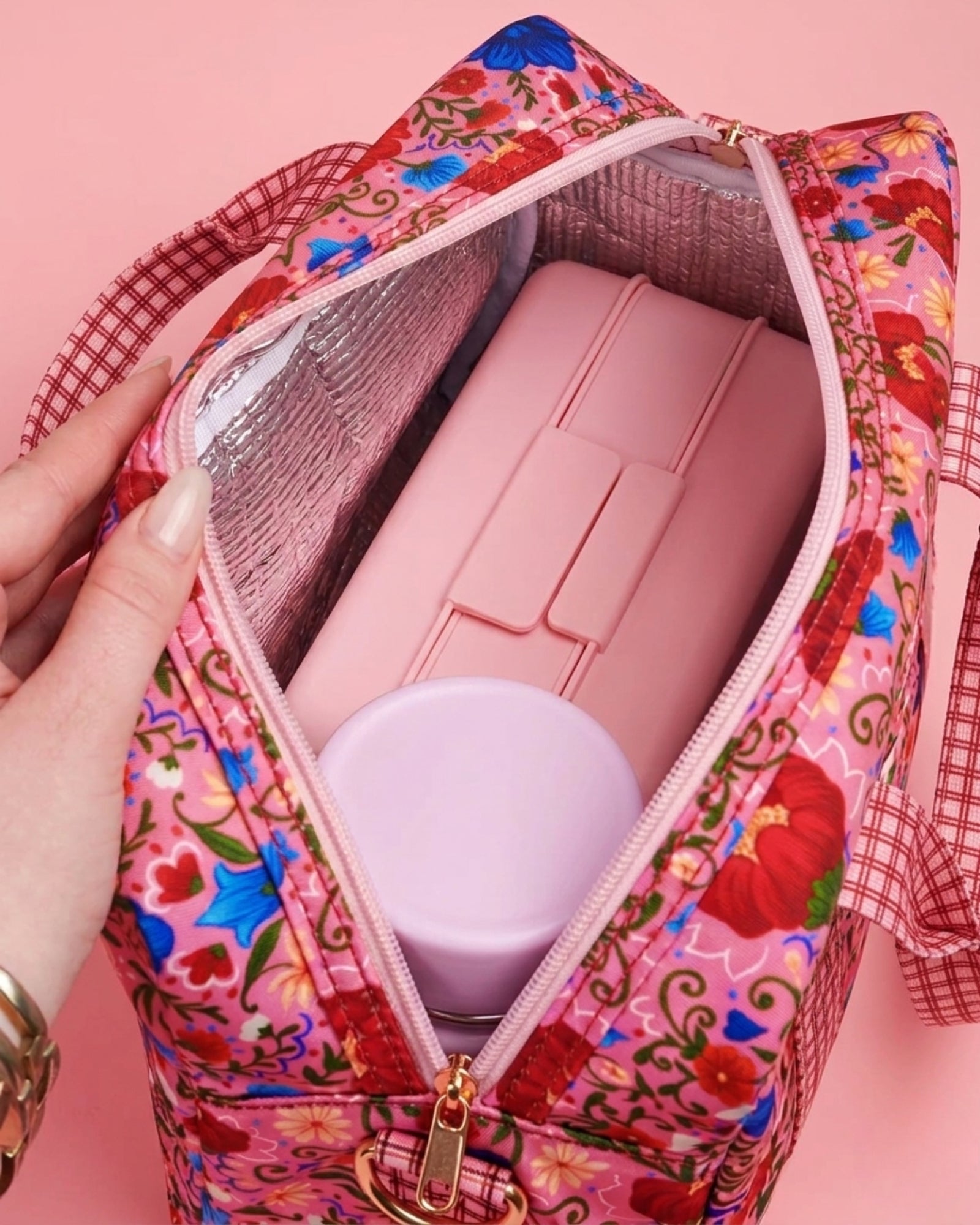 Interior view of opened Fable lunch tote showing insulated pink lining and ice pack compartments