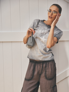 Ellidy Pullin wearing Fading Star Relaxed Baby Tee by Ena Pelly