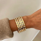 Stack of crystal pearl bangles by Fairley