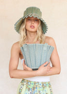 lady wearing  Fiji Capri Hat by Lorna Murray 