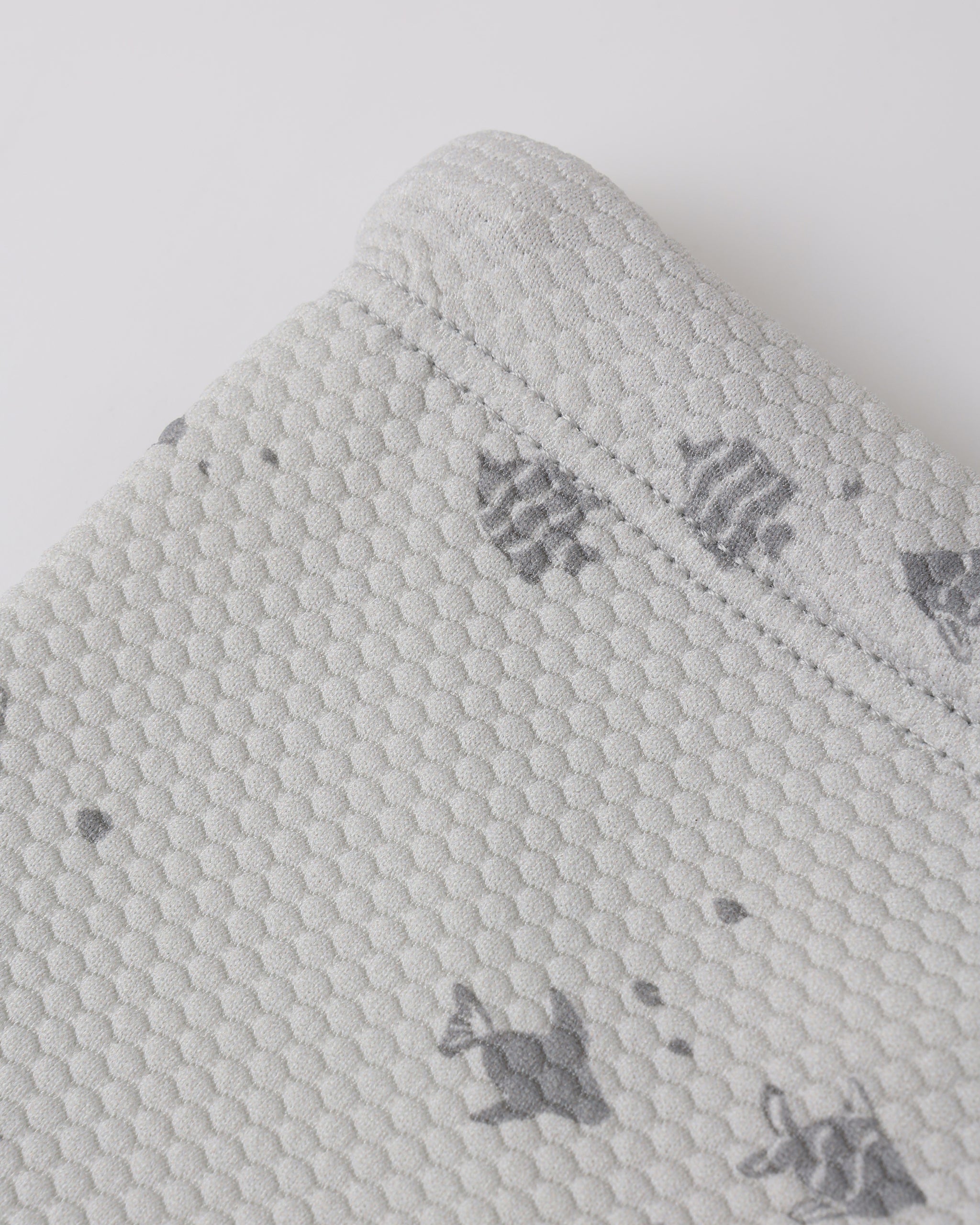 Close up of shorts fabric and print on the Finn Rashguard + Short Set Fish | Quincy Mae