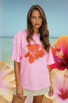 model wearing the 100% cotton pink Flaming Hibiscus T-Shirt by Sea Street