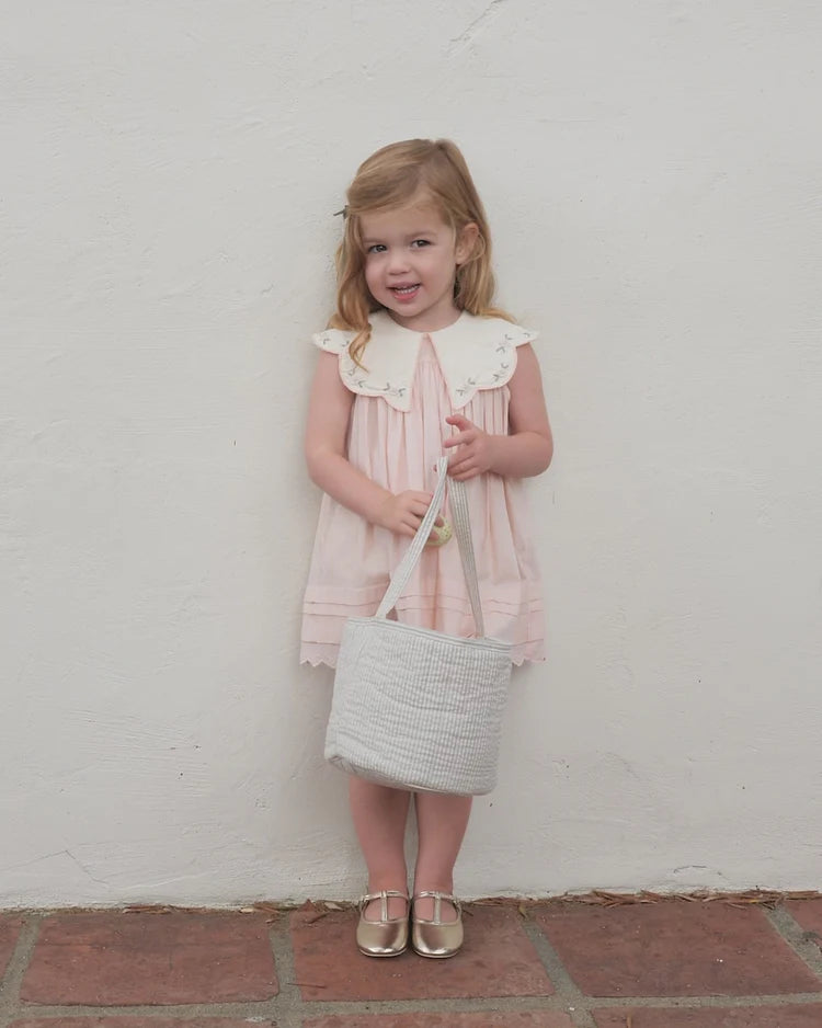 Girl wearing Florence Dress in pink by Noralee