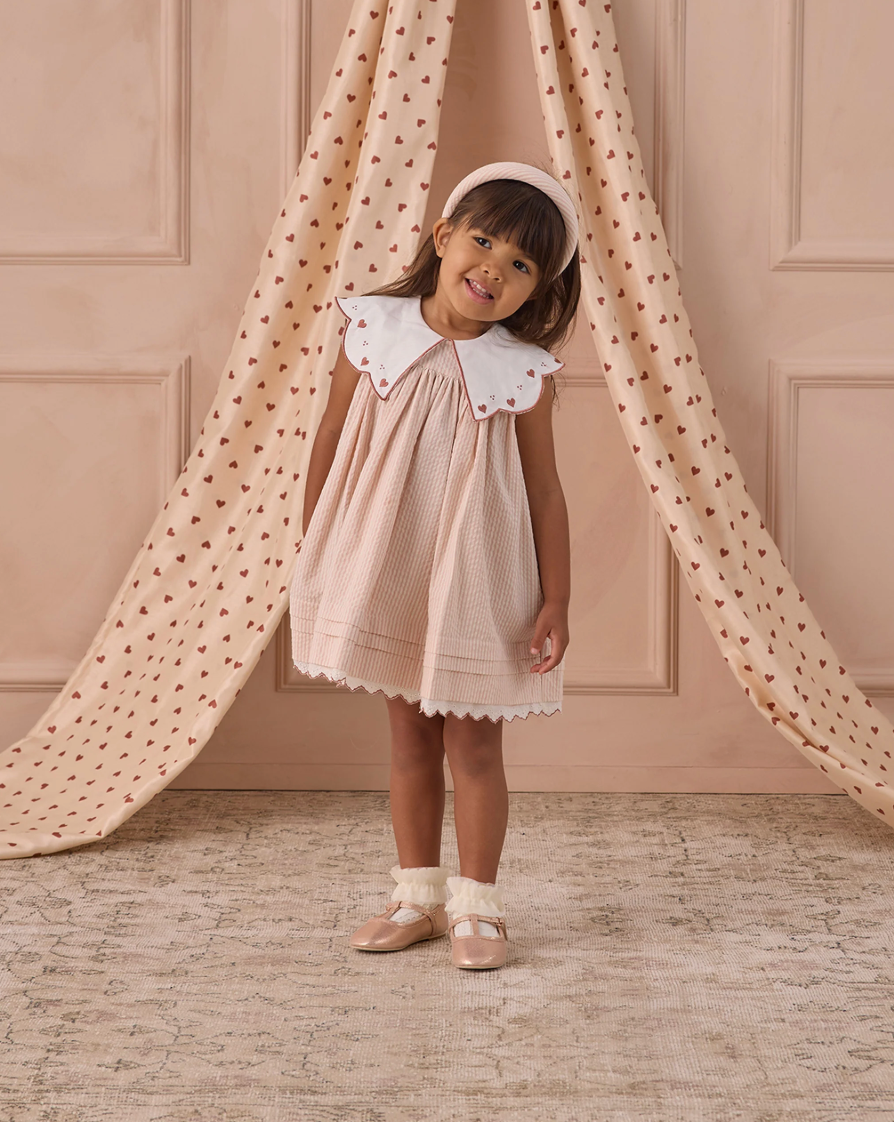 Girl wearing the Florence Dress - Petal | Noralee