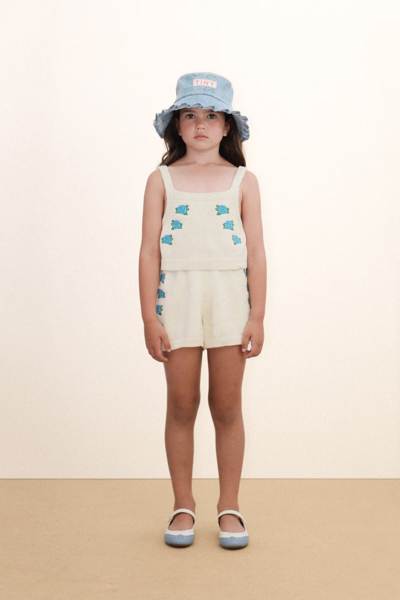 girl wearing Flowers Knitted Crop Top - Light Cream by Tiny Cottons - cream crop singlet with blue flowers