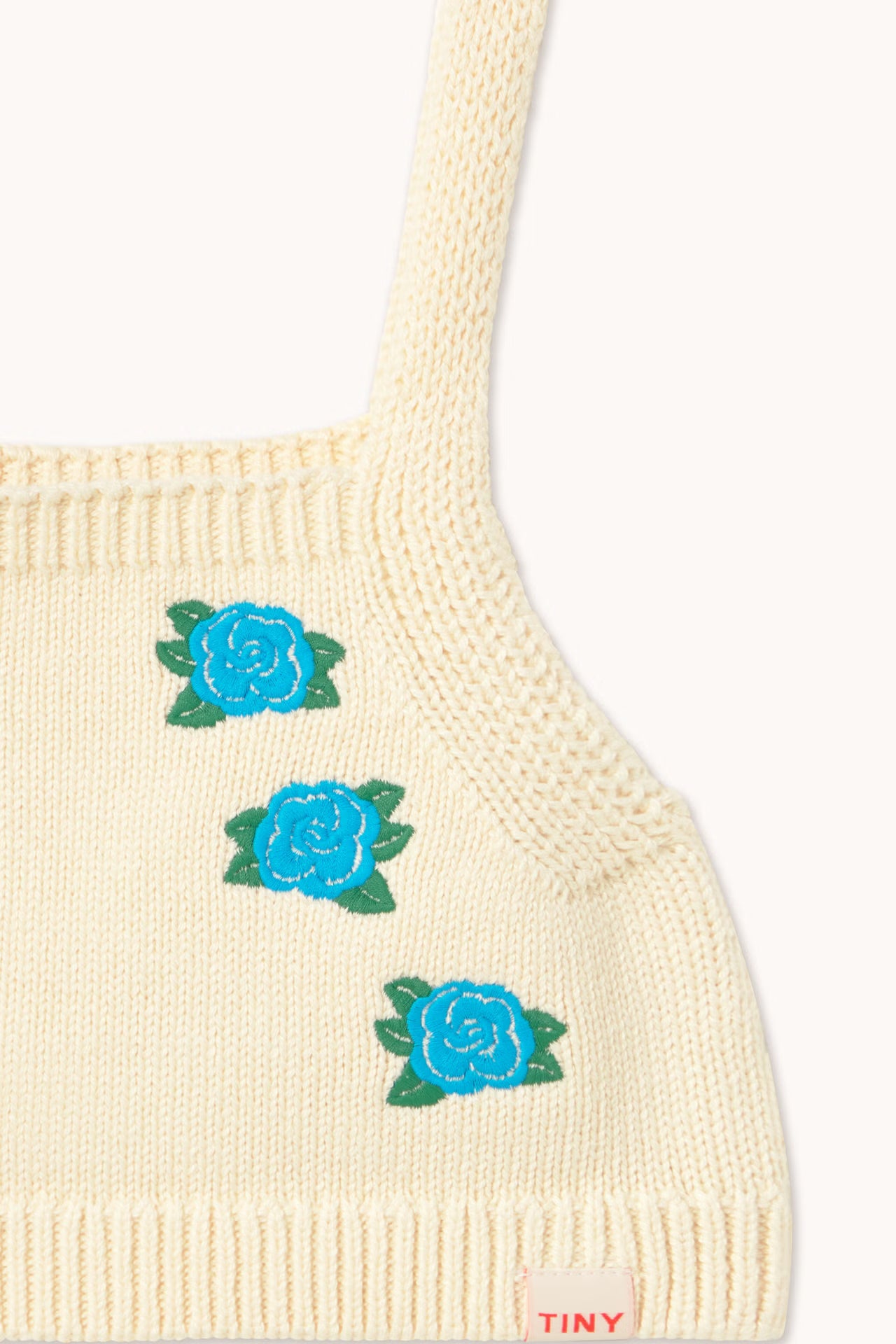 close up embroidery detail of blue flowers on Flowers Knitted Crop Top - Light Cream by Tiny Cottons