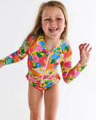 Girl wearing Follow The Sun Yellow Long Sleeve Bathers by Kip & Co