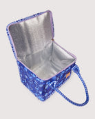 Empty lunch bag interior view displaying reflective insulated lining and zippered opening