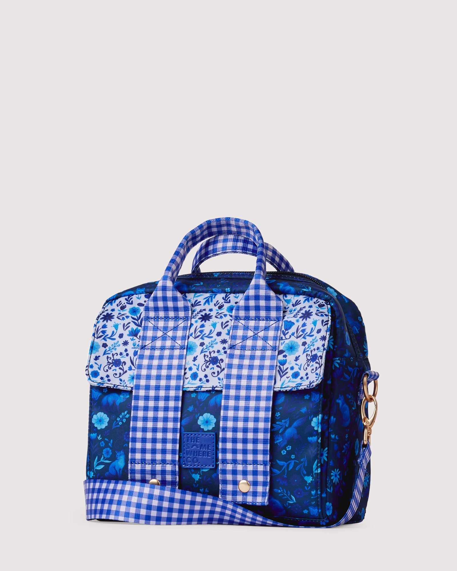Front view of Foxwood lunch tote featuring blue gingham and floral patchwork design with gold snaps
