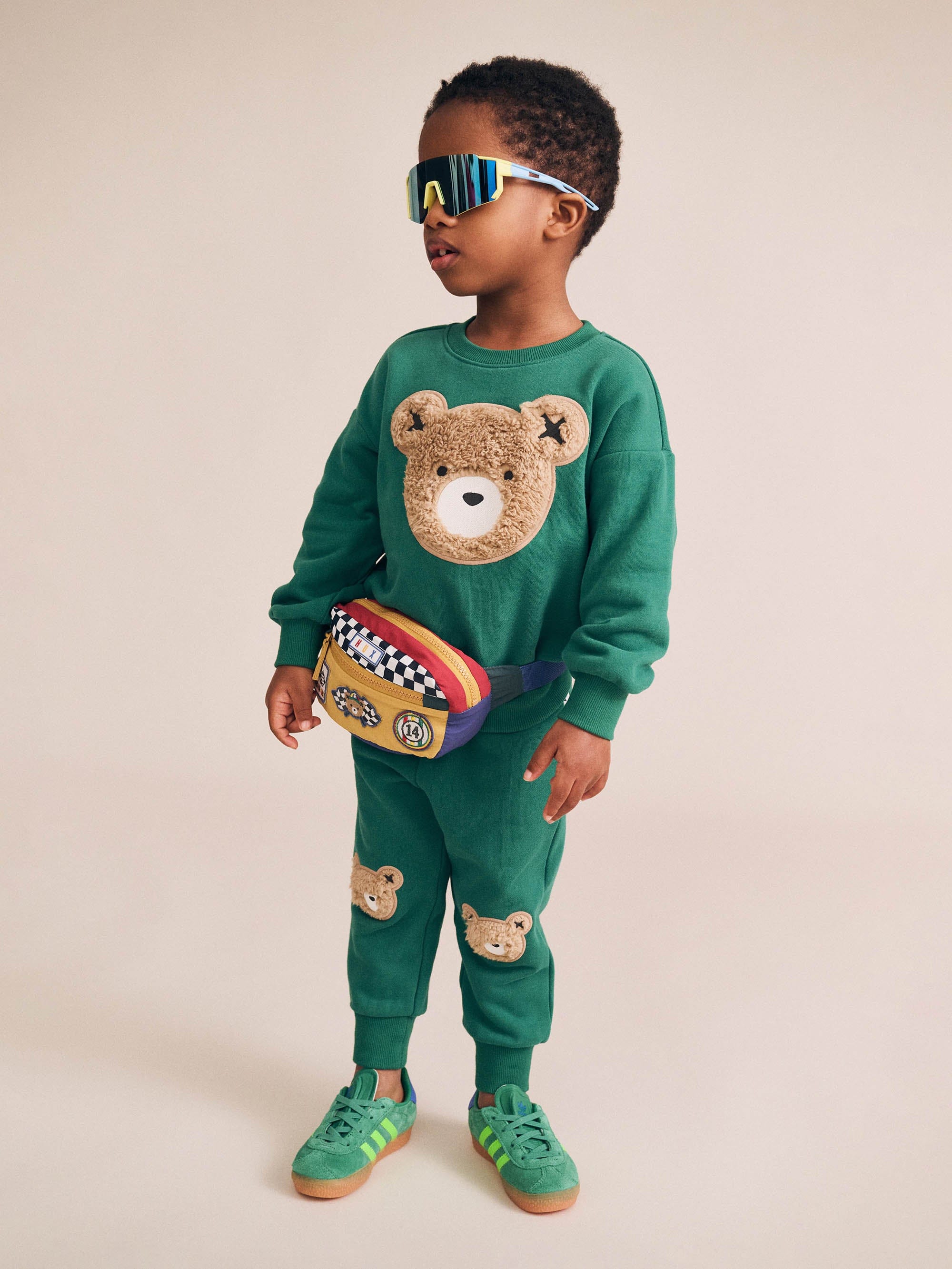 Child wearing matching set of the Furry Huxbear Emerald Trackpant | Huxbaby