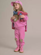 Kid wearing the pink Furry Huxbear Sweatshirt | Huxbaby