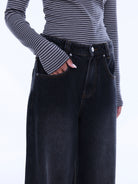 Close-up front view of Georgia Denim Jean showing dark wash wide leg fit with button closure and pockets