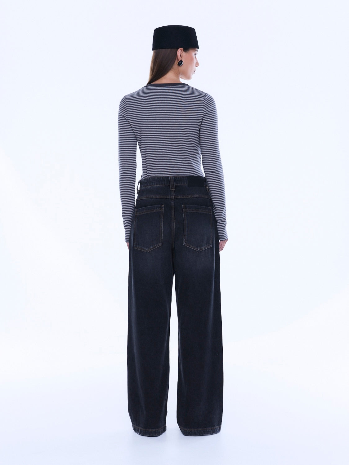 Back view of Georgia Denim Jean showcasing rear pockets and wide leg shape in dark wash denim