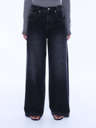 Front full view of Georgia Denim Jean highlighting high-waisted wide leg fit and button fly closure