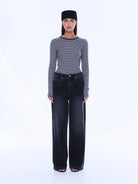 Front standing view of Georgia Denim Jean showing complete wide leg silhouette and dark wash finish
