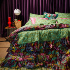 Bed setup with Genevieve Ruffle Bedcover by Sage & Clare - retro floral blanket in greens and burgundy colours