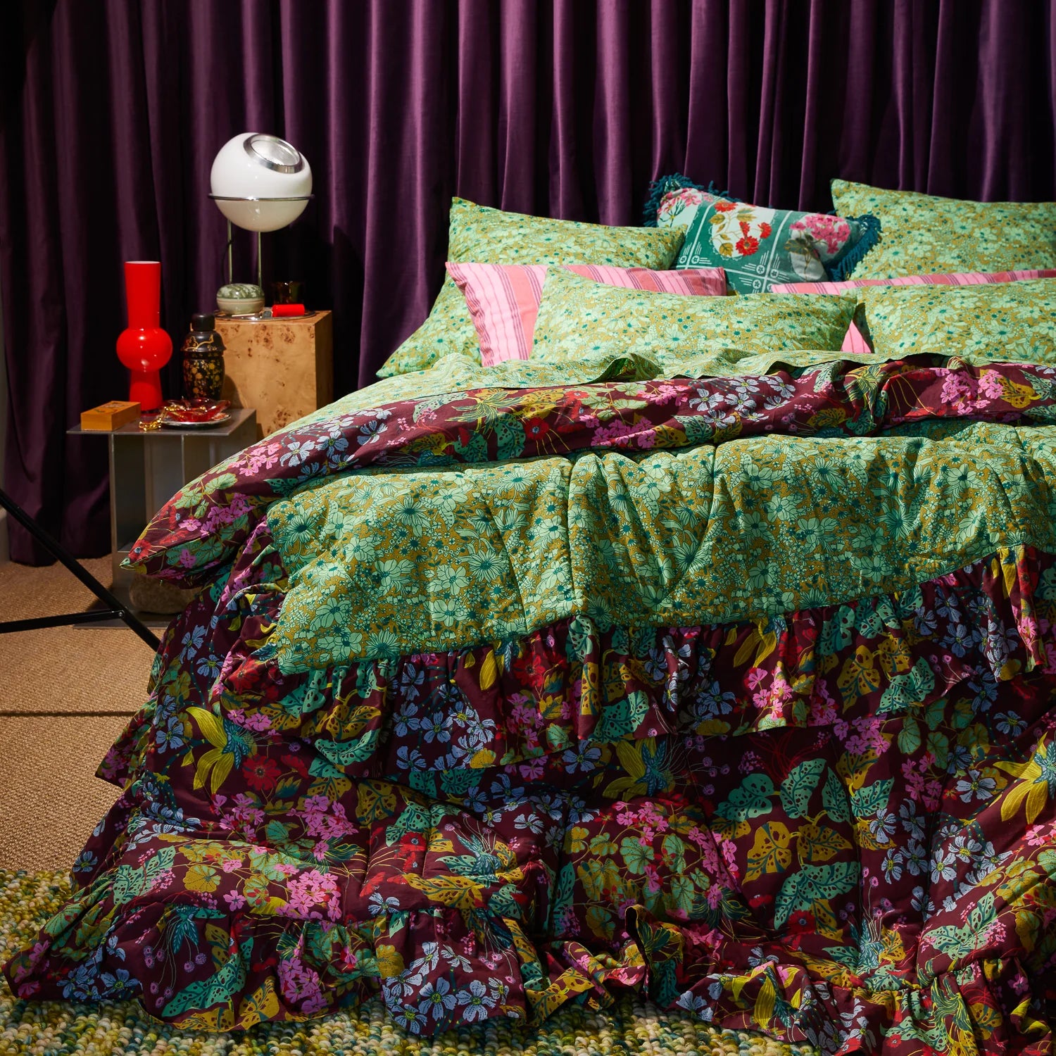 Bed setup with Genevieve Ruffle Bedcover by Sage & Clare - retro floral blanket in greens and burgundy colours