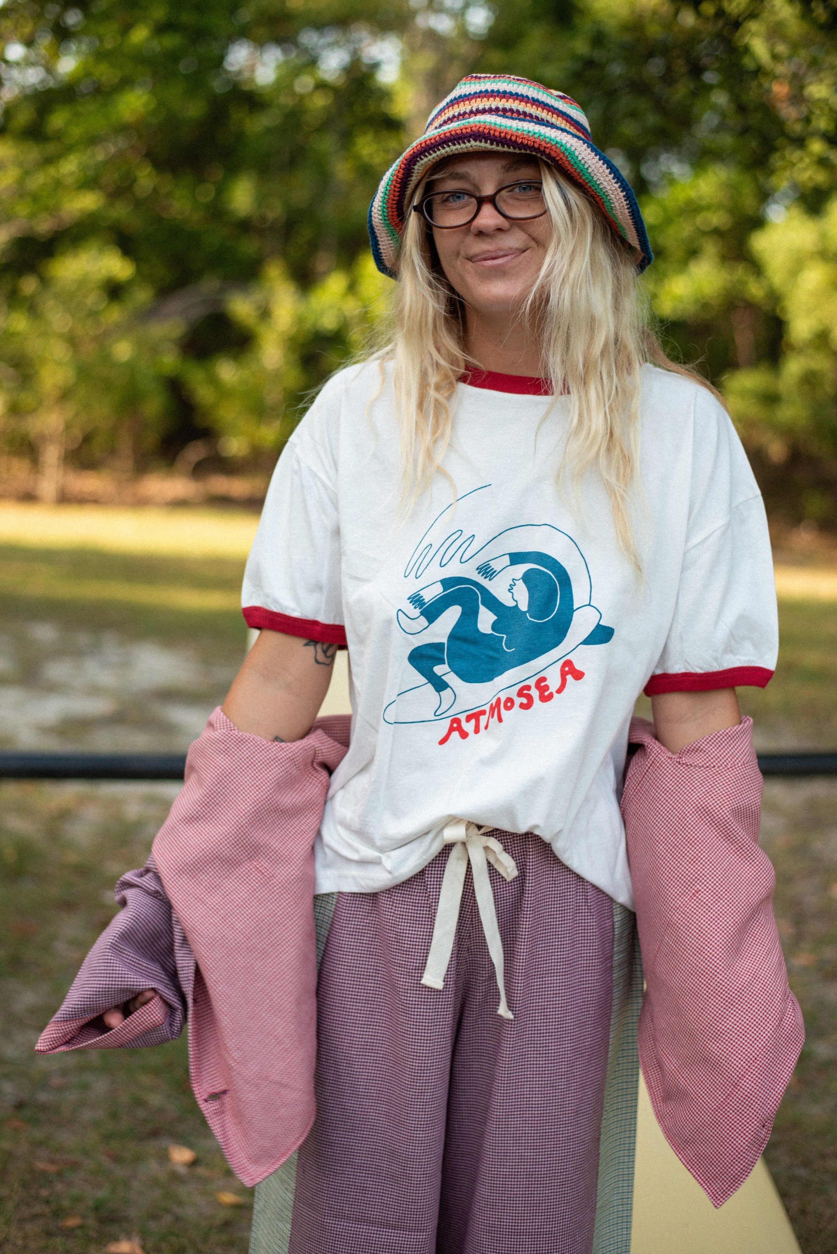 Outdoor modeling shot of Get Barrelled Artist Ringer Tee by Ty Williams showing full front design