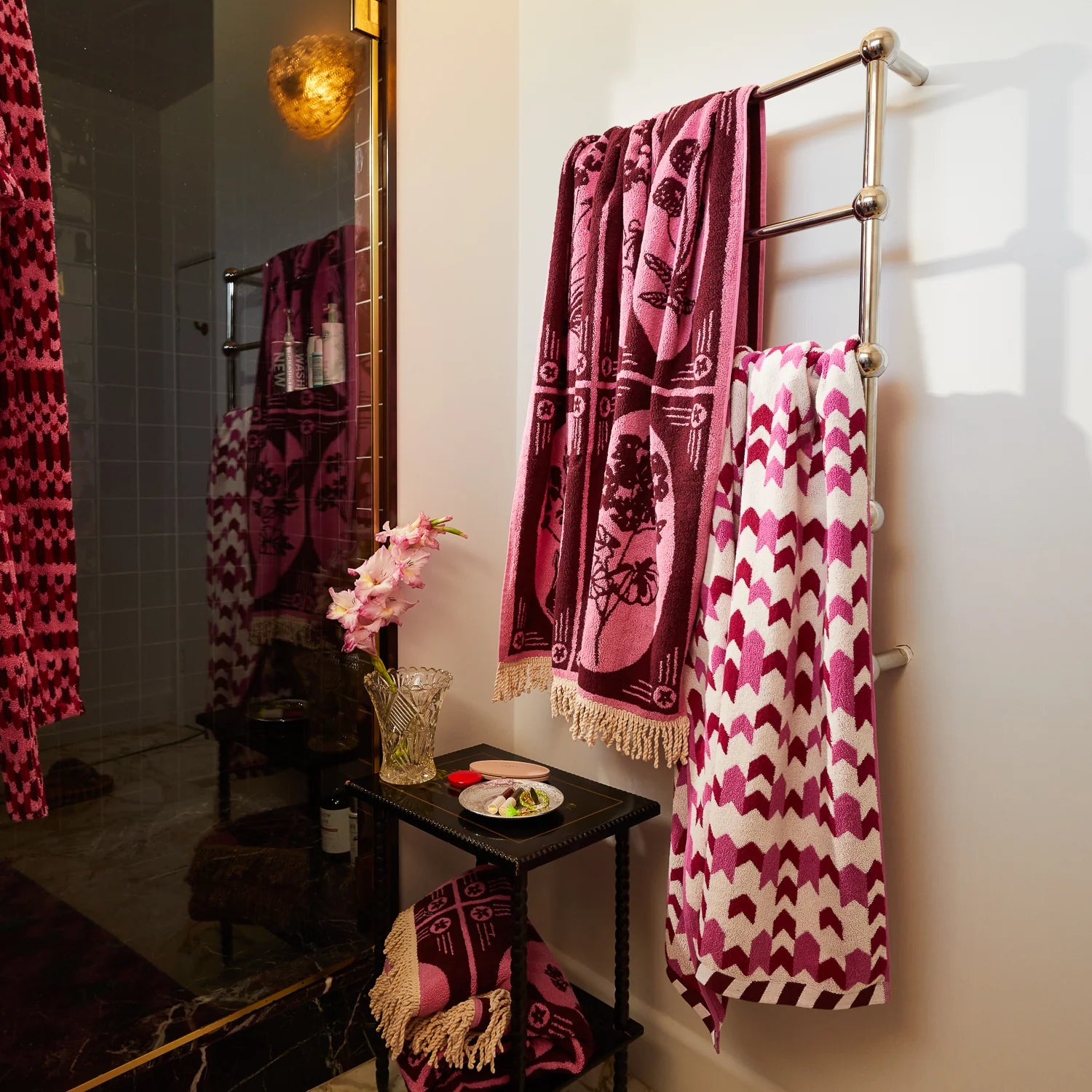 Organic cotton towel with pink and burgundy floral design by Sage & Clare