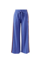 Front view of vintage blue wide leg terry trackpants with drawstring waist and side stripe