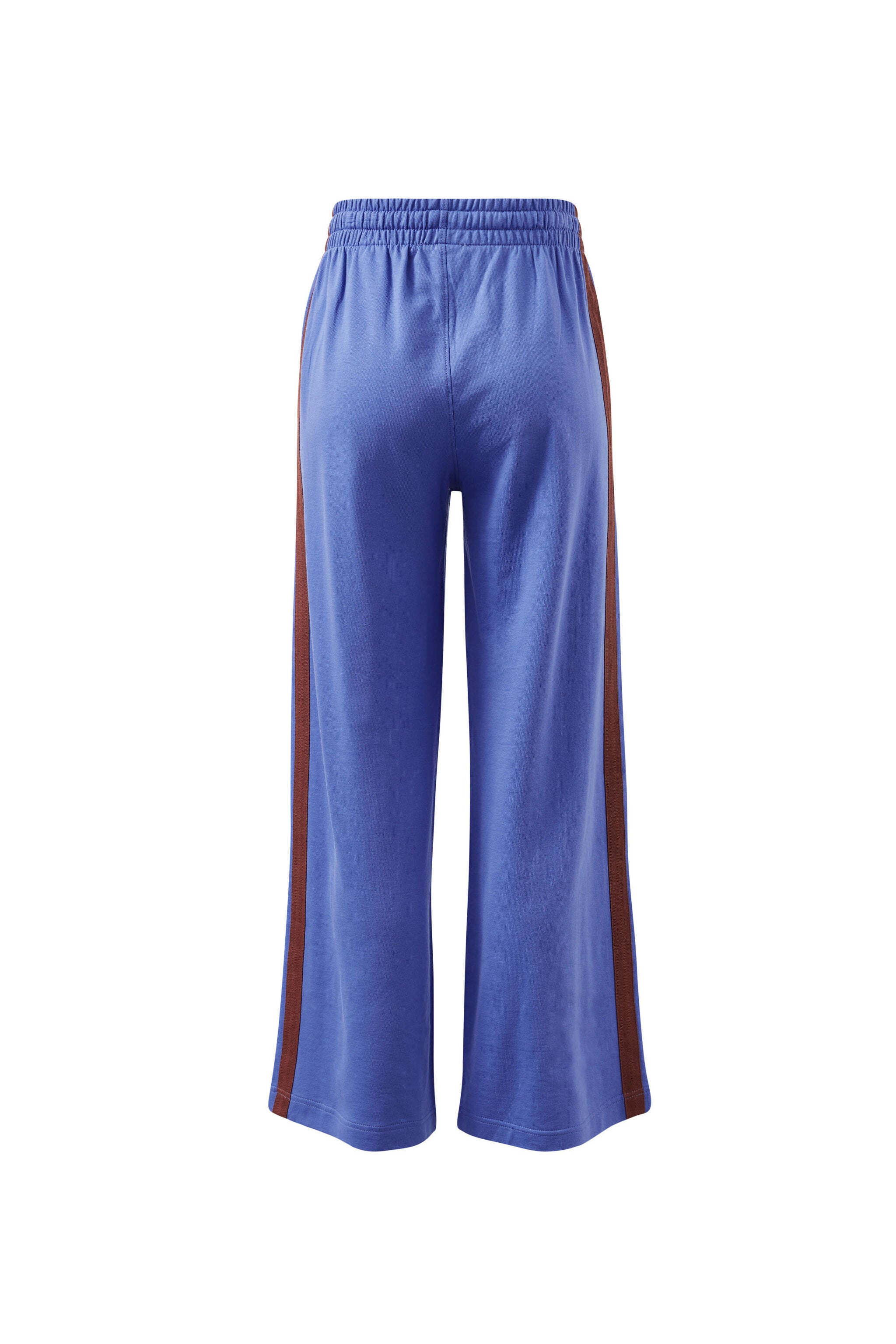 Back view of vintage blue terry trackpants displaying wide leg cut and burgundy side stripe