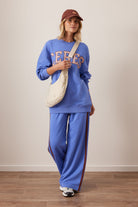 Full outfit styling with vintage blue terry trackpants paired with matching sweatshirt