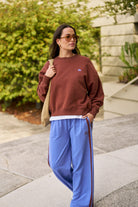 Street style look featuring vintage blue wide leg terry trackpants with coordinating top