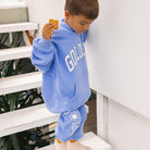 Side view of boy wearing the Golden Hoodie - Pool Blue | Golden Children