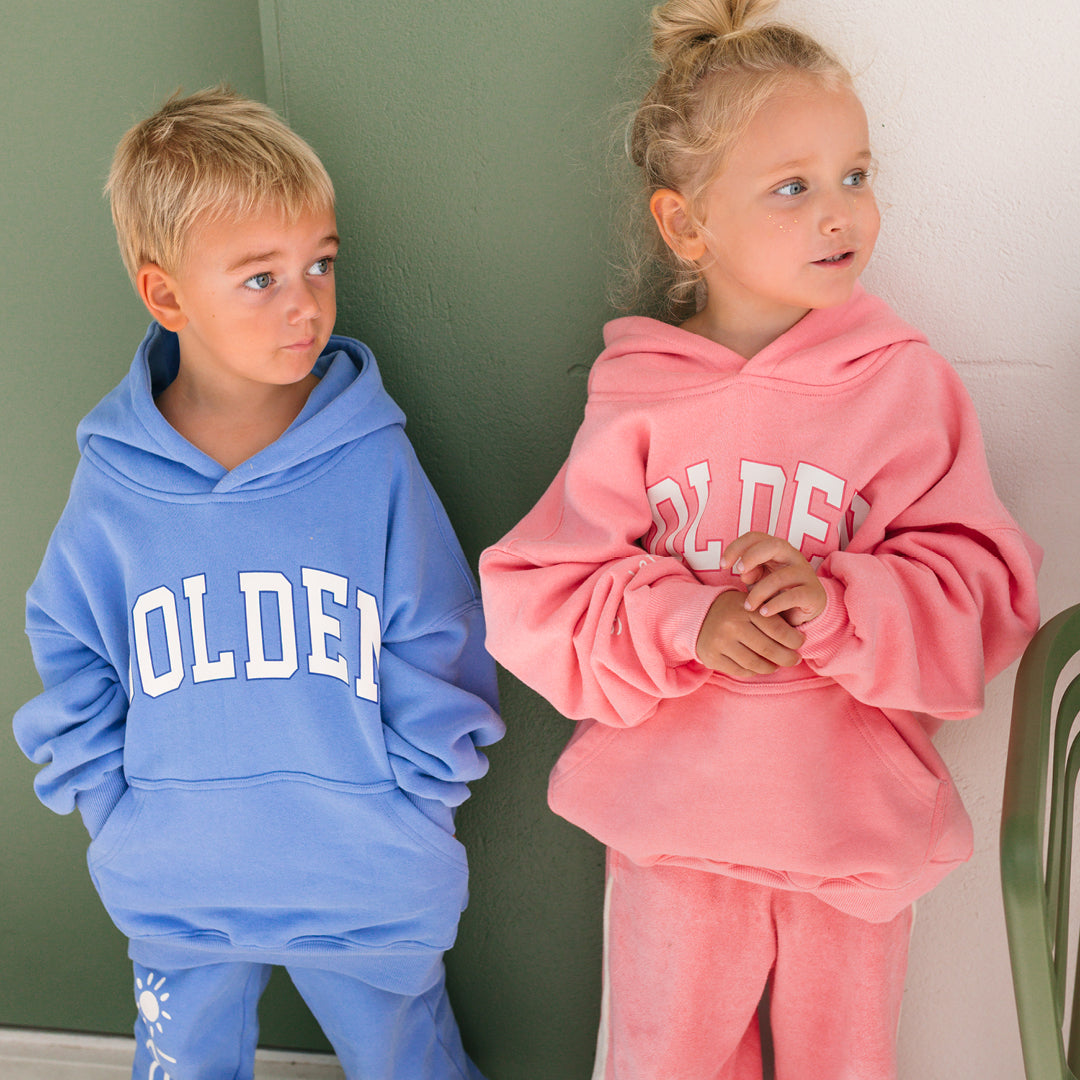 Young boy wearing the Golden Hoodie - Pool Blue | Golden Children and patching pants