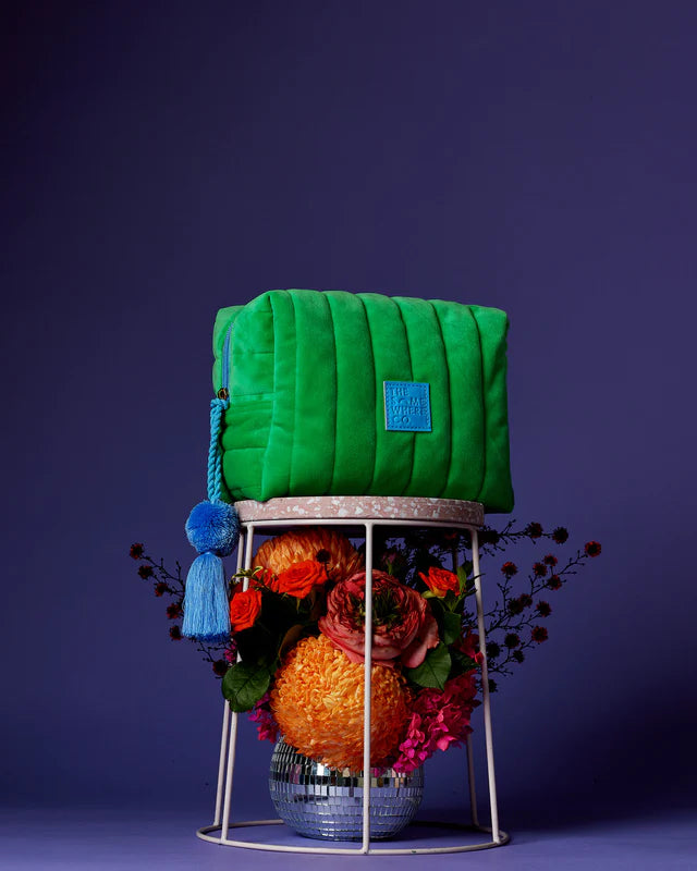 green cosmetic case with blue tassel